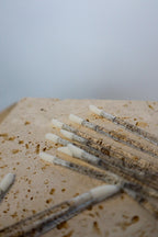 Multiple disposable lip wands on a textured surface