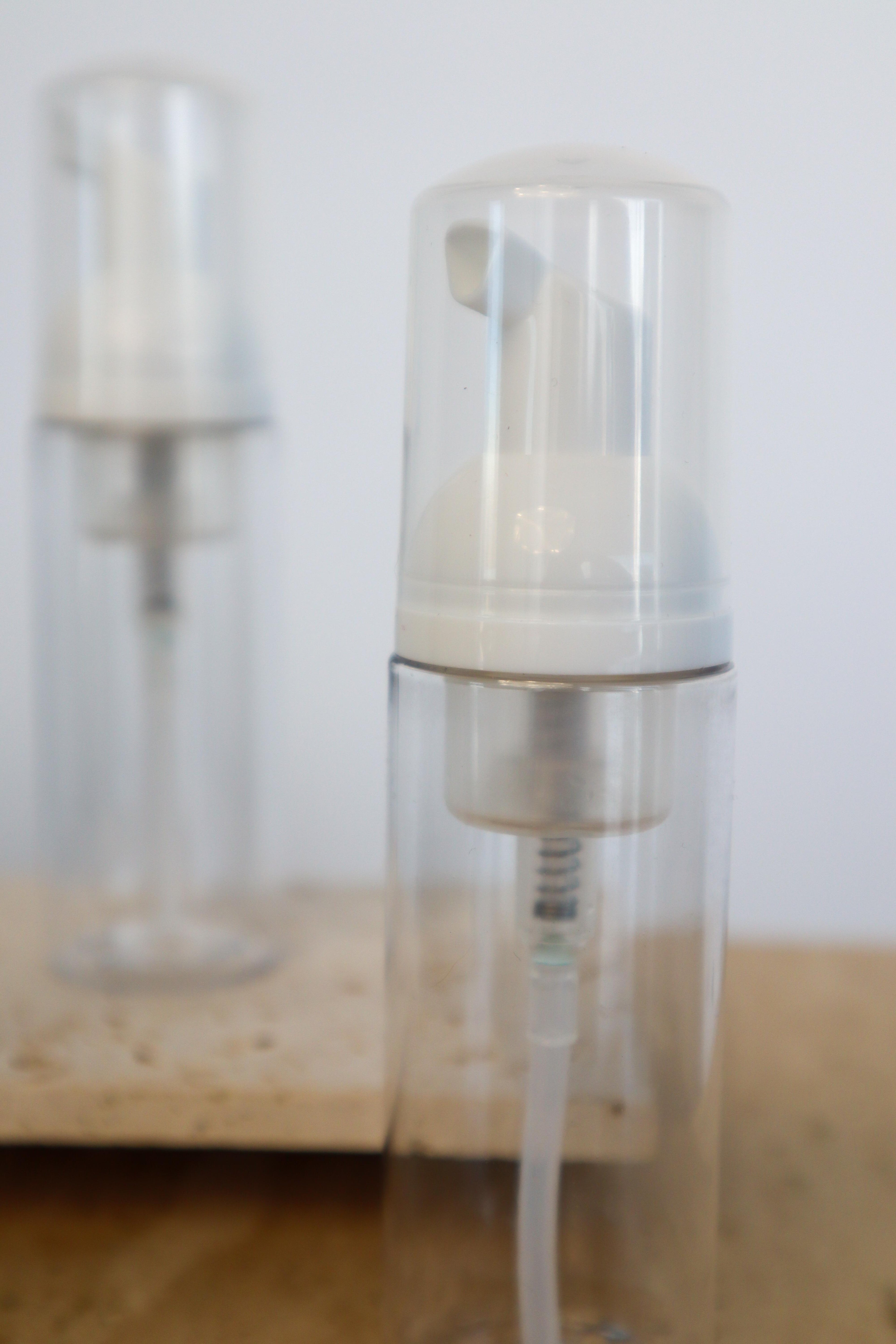 Close up of foaming bottle on blurred background