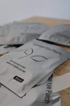 Hydrogel eye patch packaging on a wooden surface