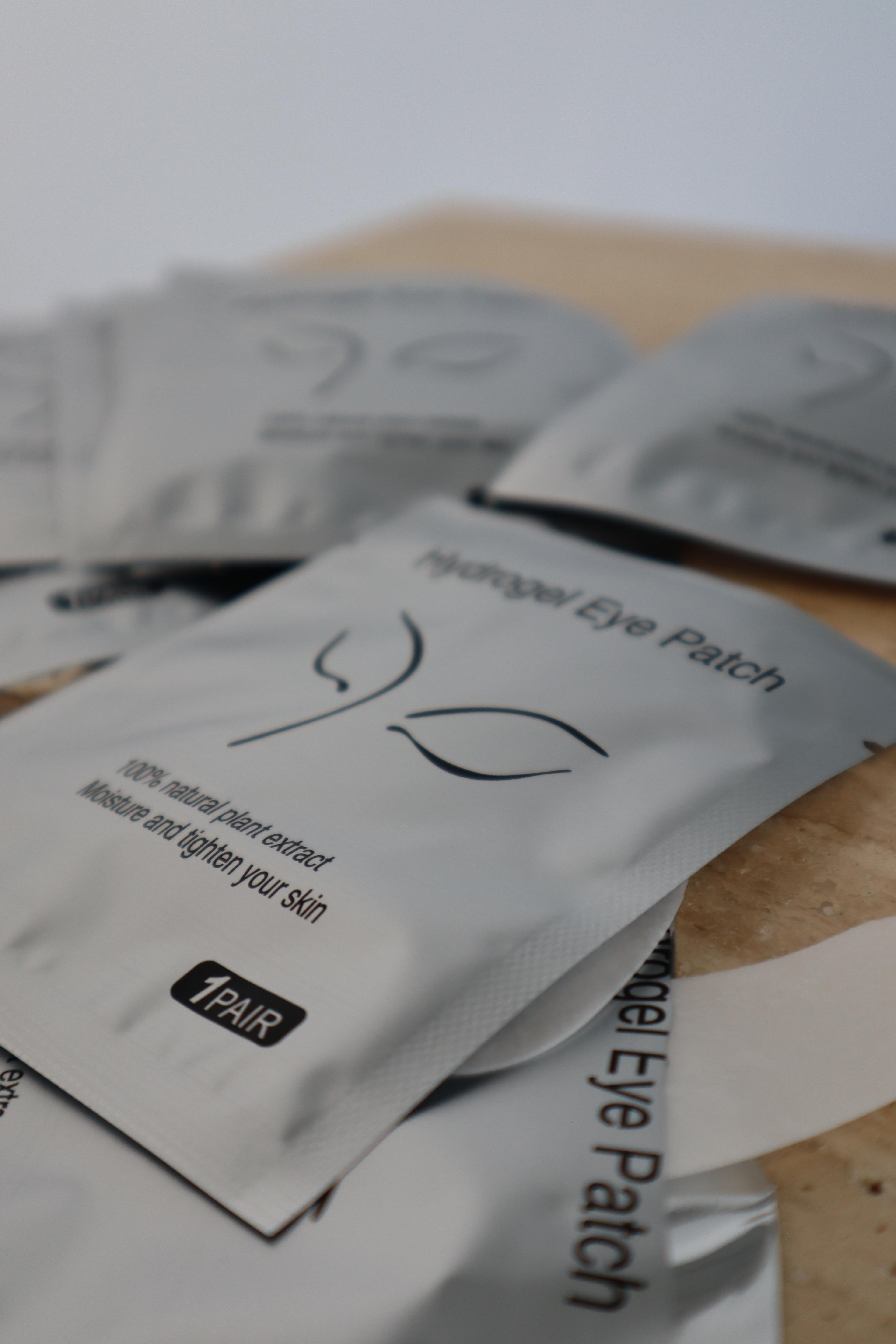 Hydrogel eye patch packaging on a wooden surface